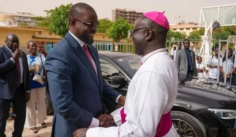 Ousmane Sonko and Monseigneur André Guéye during a meeting before the Popenguine pilgrimage