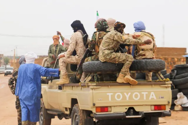 Fighters from the Coordination of Azawad Movements (CMA) patrol the city during the Congress for the fusion of movements in Kidal, August 28, 2022.