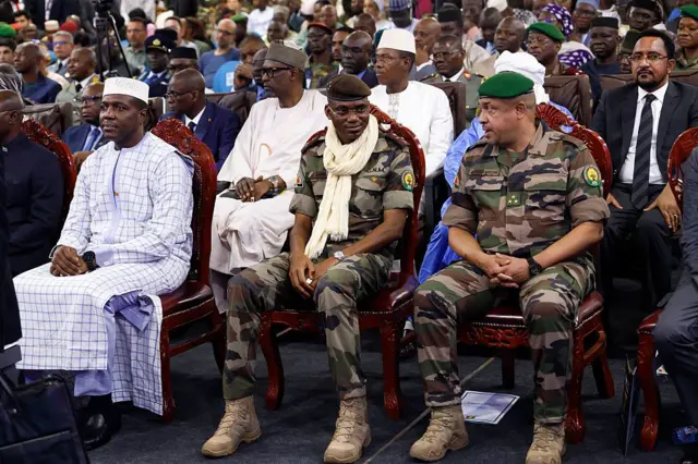 Malian Prime Minister Abdoulaye Maïga (left), Defense Minister Sadio Camara (center), and Minister of Security and Civil Protection Daouda Aly Mohammedine (second from right) attend the opening day of the Bamex 25 exhibition in Bamako, November 11, 2025.