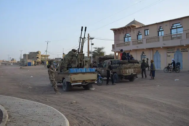 Tuareg rebels from the Azawad Liberation Front (FLA) ride in the back of pickup trucks in Kidal, April 26, 2026.