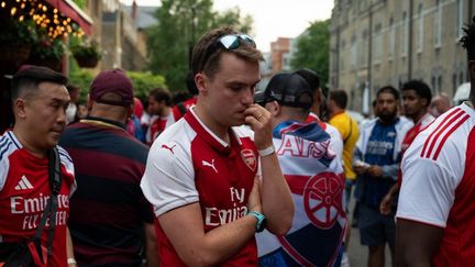 The disappointment of Arsenal supporters in London after the Champions League final defeat on May 30, 2026, against PSG.