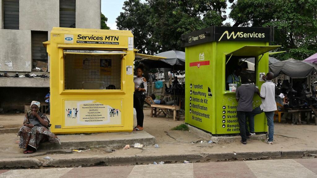 Mobile money transfer agencies in a neighborhood of Abidjan, Ivory Coast.