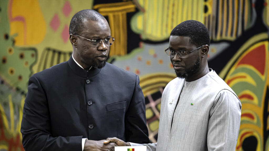 Ousmane Sonko (left), former Prime Minister of Senegal, and President Bassirou Diomaye Faye (right) at the presidential palace in Dakar on October 16, 2025.