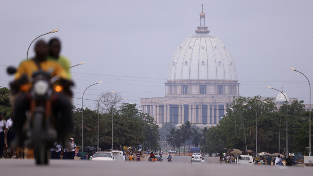 Aerial view of Yamoussoukro showing the Basilica of Our Lady of Peace (illustrative image).