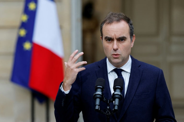 French Prime Minister Sébastien Lecornu speaks at a podium during official visit