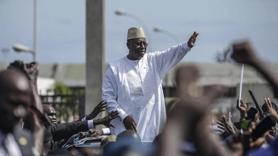 Former Senegalese president Macky Sall speaking at a podium